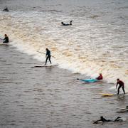 Surfers ride the first a 'five-star' Severn Bore of 2024 at Newnham