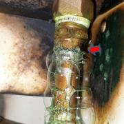 Bubbles can be seen emanating from the solder joint underneath the gas hob