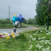 Flowers and messages have been left at the scene near St. Nicholas Church in Standish