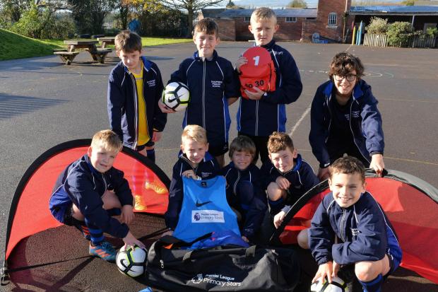 Sharpness Primary School football team with some of the new sports kit and equipment the school was presented by the Premier League Primary Stars Kit and Equipment Scheme - Photo by Steve Richards
